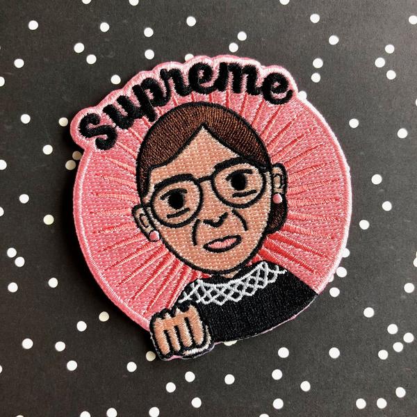 by Bored Inc. Embroidered Supreme RBG Ruth Bader Ginsburg Patch to iron-on or sew-on featuring the one and only Notorious RBG! Measures 3 x 3 inches. Also available in store at FOLD Gallery in DTLA.