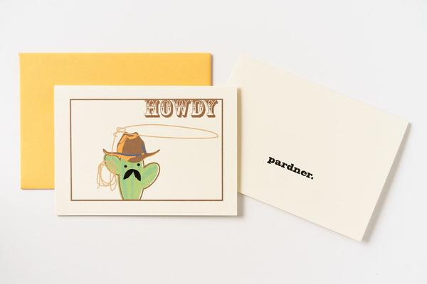 By Ilootpaperie. This folded Cactus Howdy Card is printed on premium, rich and luxurious cream 100lb cardstock. Inside text "pardner" - remaining is blank for a personal message. High quality, melon orange envelope with square flap included. Measures 4.25 x 5.5 inches. Also available in store at FOLD Gallery in DTLA.