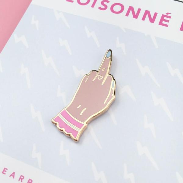 By Little Arrow. Boy Bye Pin - Light is a cloisonné enamel pin set in 22kt plated gold. Comes with a rubber clutch. Measures 0.5 x 1.25 inches. Also available in store at FOLD Gallery in DTLA.