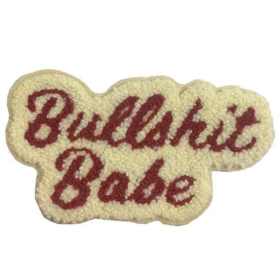 by 1606 Supply Co. Bullshit Babe Chenille Patch with iron-on backing. Measures 4 1/4 x 2 3/8 inches. Also available in store at FOLD Gallery in DTLA.