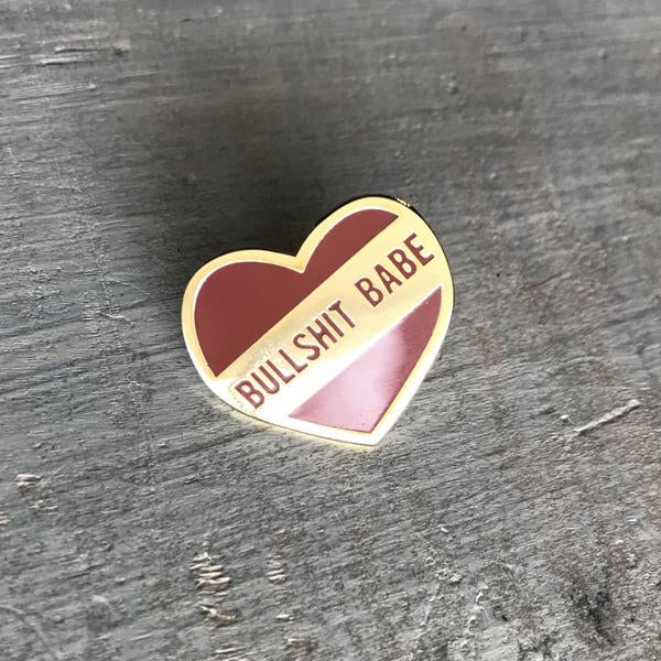 by 1606 Supply Co. This listing is for one Bullshit Babe Enamel Pin. Gold-plated and very shiny. Rubber pin back included. Measures 0.75 x 0.75 inches. Also available in store at FOLD Gallery in DTLA.