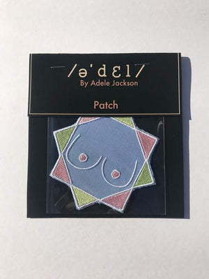 By Adele by Adele Jackson. Iron on backing machine embroidered Boob Patch. Measures 4 inches. Available at FOLD Gallery.