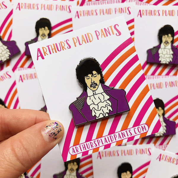 by Arthur's Plaid Pants. Prince Enamel Pin: Hard Enamel. Die struck. 2 Military clutches. Measures 1.5 inches. Also available in store at FOLD Gallery DTLA.