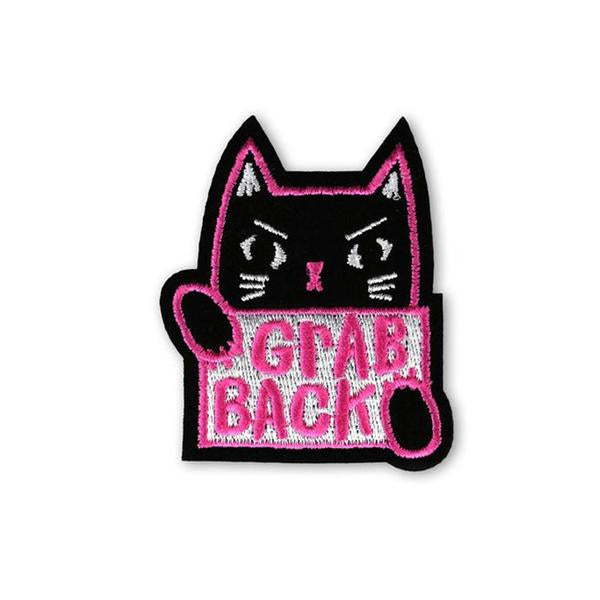 By Badge Bomb. It's time to grab back! Iron-on Grab Back Patch. Illustration by artist Allison Cole. Comes packaged in individual hang bag. Measures 2.25 x 2.75 inches.