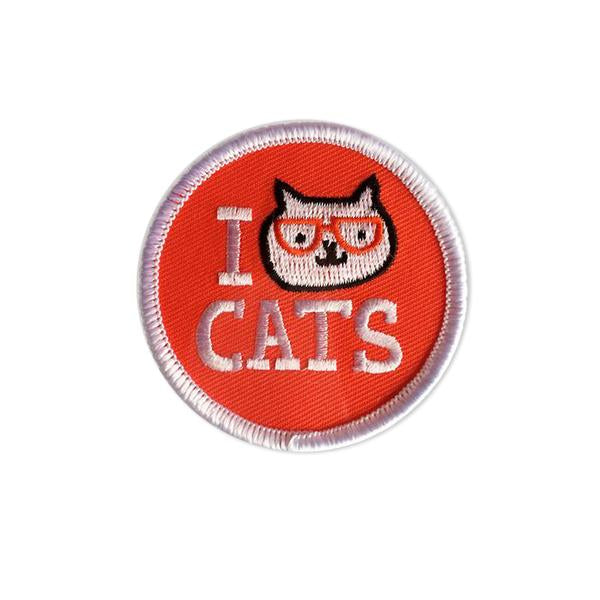 By Badge Bomb. Iron on I Cat Cats Patch by Gemma Correll. Comes packaged in individual hang bag. Measures 2.25 inches. Also available in store at FOLD Gallery DTLA.
