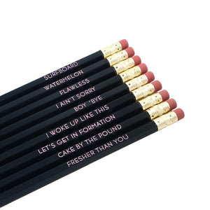 by LZPENCILS. The Beyoncils Pencil Set features 9 of your favorite Beyoncisms, including: SURFBOARD, WATERMELON, FLAWLESS, I AIN'T SORRY, BOY 'BYE, I WOKE UP LIKE THIS, LET'S GET IN FORMATION, CAKE BY THE POUND and FRESHER THAN YOU. Pale pink imprint on black pencils. Pencils write in standard gray #2 graphite. FOLD Gallery Dtla.
