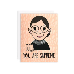 by Bored Inc. You Are Supreme RBG Ruth Bader Ginsburg Card. Tell your favorite gal she's SUPREME with this tribute to The Notorious RBG! Card is blank inside, comes with plain white envelope. Digitally printed using high quality, archival dye based inks on a heavyweight matte card. Measures 4 1/4 x 5 1/2 inches. FOLD Gallery Dtla.