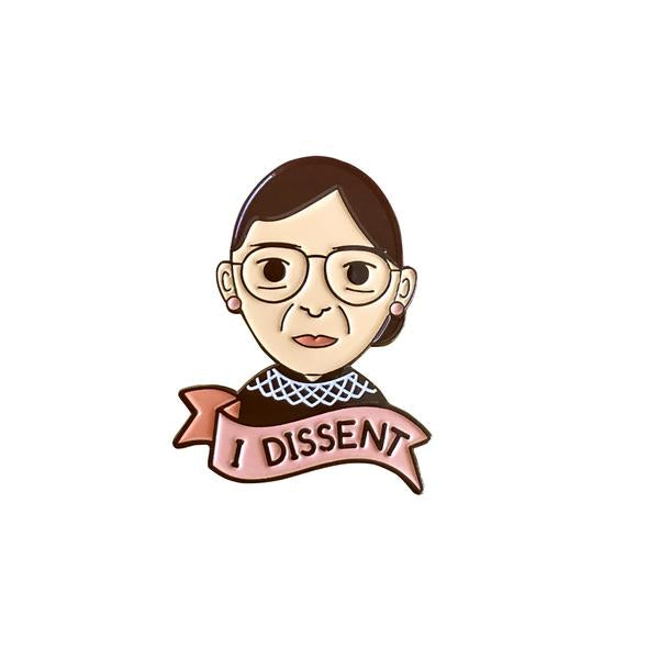 by Bored Inc. Ruth Bader Ginsburg RBG "I Dissent" Pin. Soft enamel pin comes with black rubber clutch. Measures 1.25 inches. Also available in store at FOLD Gallery DTLA.