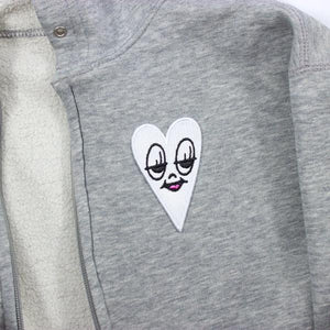By Chris Uphues. High quality, 100% embroidered, iron-on Little Ghost Heart Patch. Measures approx. 2.5 x 1.5 inches. Also available in store at FOLD Gallery DTLA.