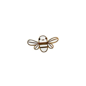 By Chris Uphues. This Mini White Golden Bee Pin is made with super shiny gold plated metal and filled with smooth, high quality, glossy enamel. Pin comes with a rubber clutch for extra grip. Perfect for gifting! Pin measures 1 inch wide. Also available in store at FOLD Gallery DTLA.
