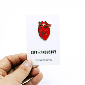 By City of Industry. An Anatomical Heart Pin with gold plating. Measures approximately 1.25 inch long. Also available in store at FOLD Gallery.
