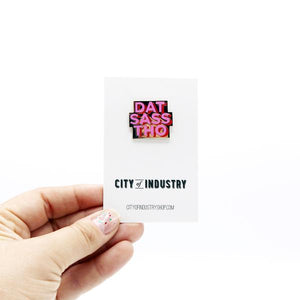 By City of Industry. Let's be clear: Sass is not a bad thing. We know you've got wit, and I have a sneaking suspicion that you've got style. Wear your sass on your sleeve. Cloisonne Dat Sass Pin with gold plating. Measures approximately 1 inch wide. Also available in store at FOLD Gallery in DTLA.