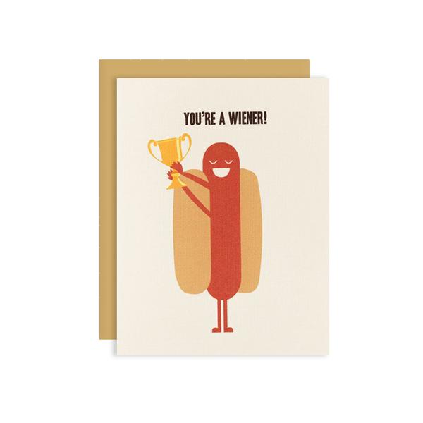 By Ilootpaperie. You're a Wiener Card. This folded card is printed on premium, rich and luxurious cream linen 100lb cardstock. Inside is blank for personal message. High quality, tan envelope with square flap included. Measures 4.25 x 5.5 inches. FOLD Gallery Dtla.