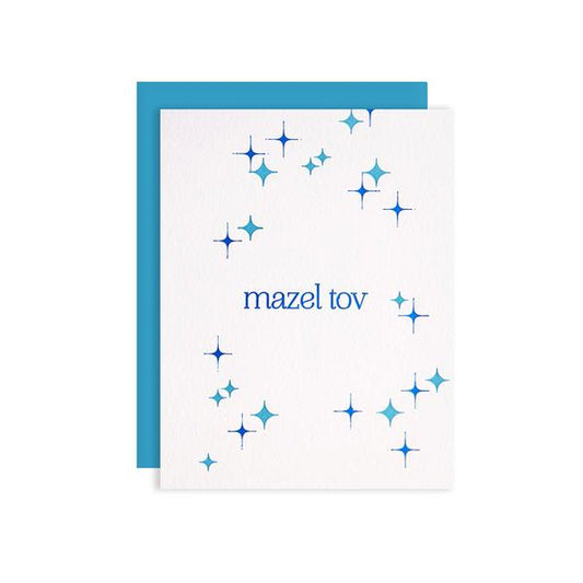by Kiss and Punch Designs by Julie Stewart. Celebrate a marriage, mitzvah, birth or other special occasion with this Mazel Tov Blue Foil Card! Paper - printed on Crane Lettra 110 lb. paper. Color - blue foil and letterpress. Envelope - A2 blue envelope. Packaging - individually wrapped in a cellophane sleeve. Also available in store at FOLD Gallery DTLA.