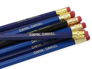by LZ Pencils. Listing is for one Damn Daniel Pencil. All type is set by hand and lovingly hand-pressed onto each and every pencil. Pencils write in standard #2 gray graphite, perfect for gifting. PLEASE NOTE COLORS ARE RANDOM AND WILL VARY FROM WHAT IS PICTURED.