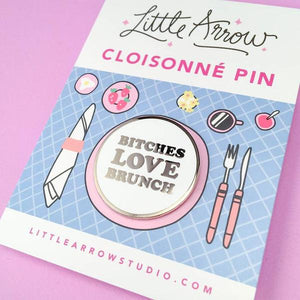 By Little Arrow. Bitches Love Brunch Lapel Pin features: Cloisonné hard enamel set in 22kt plated gold and dual pins with rubber backs. Measures 1.25 x 1.25 inches.