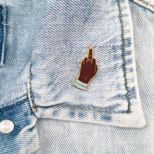 By Little Arrow. Boy Bye Pin - Dark is a cloisonné enamel pin set in 22kt plated gold. Comes with a rubber clutch. Measures 0.5 x 1.25 inches. Also available in store at FOLD Gallery in DTLA.