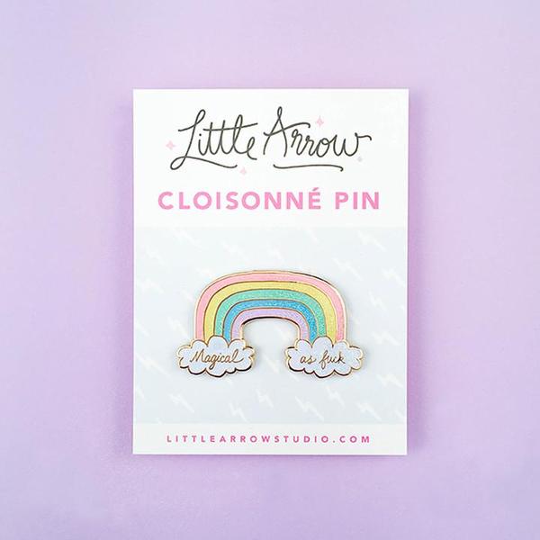 By Little Arrow. Magical AF Rainbow Pin. Measures 1.25 x 2 inches. Cloisonné hard enamel set in 22kt plated gold. Rubber clasp. Also available in store at FOLD Gallery DTLA.