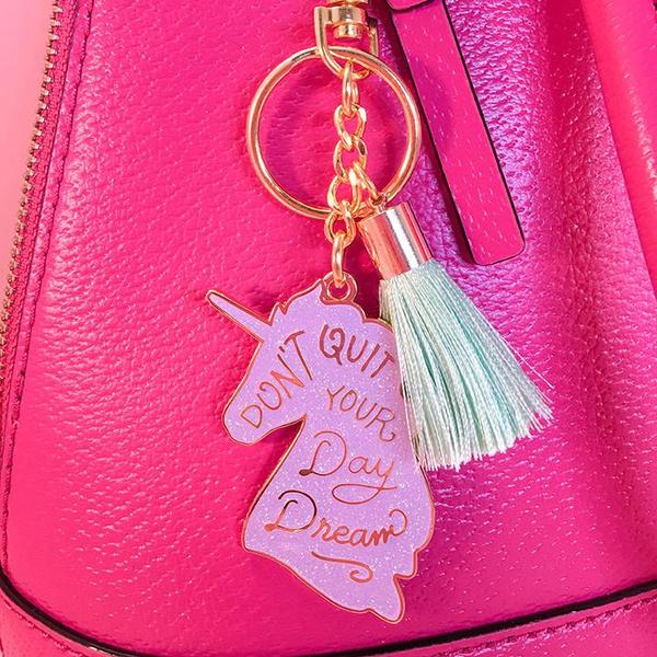 By Little Arrow. Unicorn Daydreams Keychain. Cloisonné hard enamel set in 22kt plated gold. Plated gold hardware and adorned with a silk tassel. Measures 2 inch wide x 4.75 inch tall. Also available in store at FOLD Gallery DTLA.
