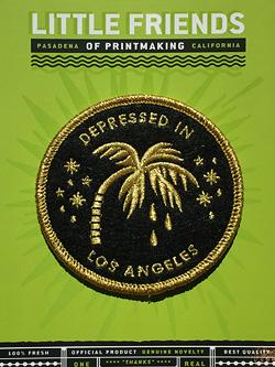 By Little Friends of Printmaking. Embroidered Depressed in Los Angeles Patch. Being bummed out has never been so exciting. Embroidered in metallic gold thread on black felt! Measures 3 x 3 inches.