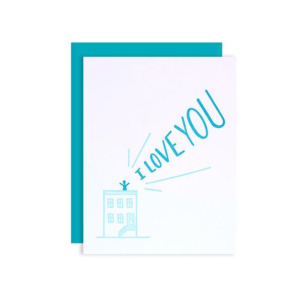By Loudhouse Creative. I Love You Rooftop Card: two-color letterpress printing, hand-drawn illustrations, 100% brilliant white cotton paper, blank inside, matching teal envelope, cello sleeve packaging. Hand-printed on an antique letterpress in Los Angeles, California. Folded card measures 4.25 x 5.5 inches. Also available in store at FOLD Gallery DTLA.