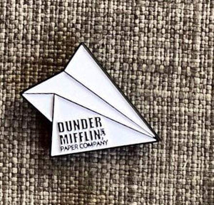 By Loudmouth Pin Co. Dunder Mifflin Airplane pin. Comes with one rubber backing.  Measures approximately 1 x 1 inches.