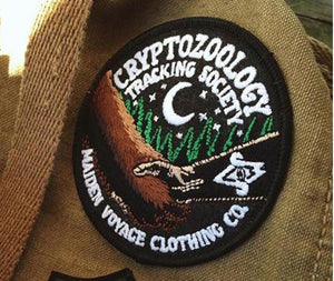 By Maiden Voyage Clothing Co. Friends of Cryptid Wildlife Patch - Glows in the dark! The patch is accented with glow in the dark thread, for those late night tracking excursions!Iron-on (sewing still recommended). Measures 3.25 inch wide.