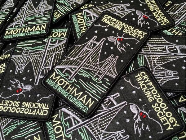 By Maiden Voyage Clothing Co. Mothman Rectangle (Bridge) Patch: This Cryptozoology Tracking Society patch is reminiscent of the old fashioned National Park patches, but features a cryptid character in their natural habitat! Show your support for the Cyrptozoology Tracking Society! Iron-on (sewing still recommended). Also available in store at FOLD Gallery DTLA.
