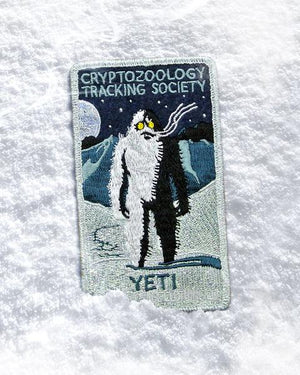 By Maiden Voyage Clothing Co. Yeti Patch. This Cryptozoology Tracking Society patch is reminiscent of the old fashioned National Park patches, but features a cryptid character in their natural habitat! Show your support for the Cyrptozoology Tracking Society! Iron-on (sewing still recommended). Measures 2.5x4.25 inch. FOLD Gallery Dtla.