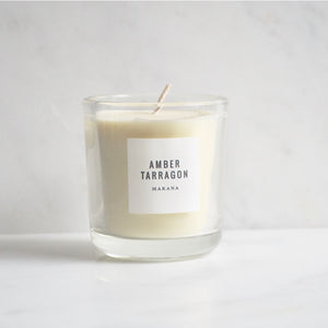 By Makana Candles. Amber Tarragon Candle: Resinous amber accented by vanilla and fennel, unveiling a heart of fresh tarragon, tuberose and basil, and finished with an accord of sensuous woods. Hand-poured in-house in small batches using simple, clean ingredients.