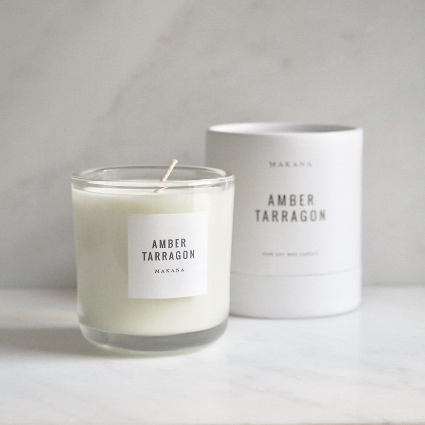 By Makana Candles. Amber Tarragon Candle: Resinous amber accented by vanilla and fennel, unveiling a heart of fresh tarragon, tuberose and basil, and finished with an accord of sensuous woods. Hand-poured in-house in small batches using simple, clean ingredients.
