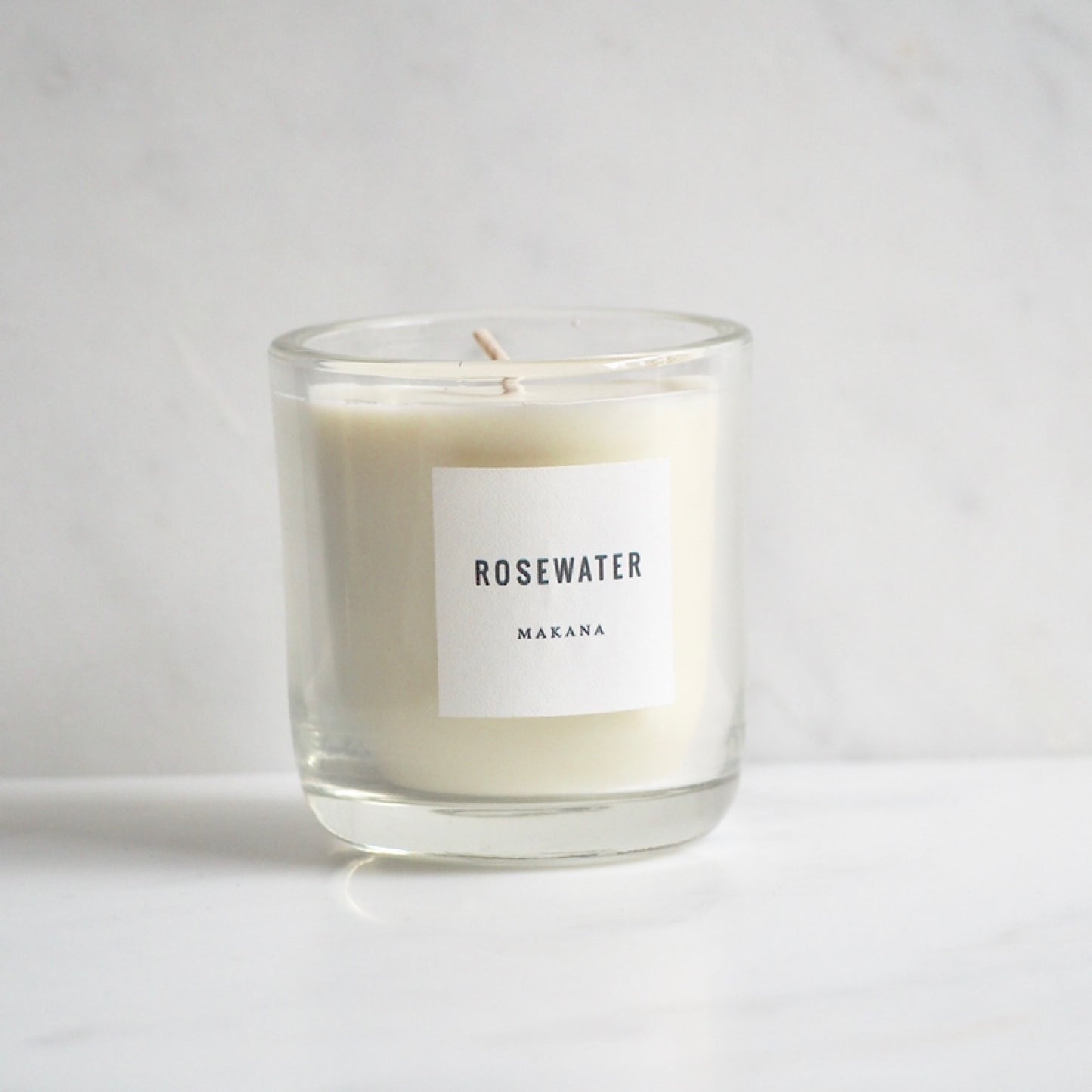 By Makana Candles. Rosewater Candle: A soft garden rose fragrance with a citrus undertone. Notes of geranium and violet are revealed, while vetiver and rosewood lightly ground this beautiful scent. Hand-poured in-house in small batches using simple, clean ingredients.