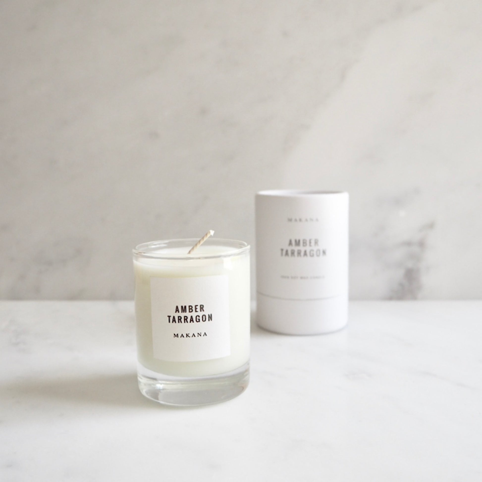 By Makana Candles. Amber Tarragon Candle: Resinous amber accented by vanilla and fennel, unveiling a heart of fresh tarragon, tuberose and basil, and finished with an accord of sensuous woods. Hand-poured in-house in small batches using simple, clean ingredients.