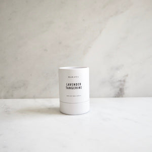 By Makana Candles Lavender Tangerine Candle: A composition of lavender, eucalyptus and tangerine, this scent promotes balance, peace and mindfulness. Hand-poured in-house in small batches using simple, clean ingredients – 100% soy wax, lead-free cotton wicking, and phthalate-free fragrances.