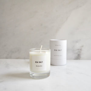 By Makana Candles Sea Salt Candle: Traveling across thousands of miles, tropical trade winds carry notes of fresh sea salt with hints of lush island foliage and flora. This fragrance is reminiscent of warm, breezy coastal days when beyond the horizon, the sky magically meets the sea.