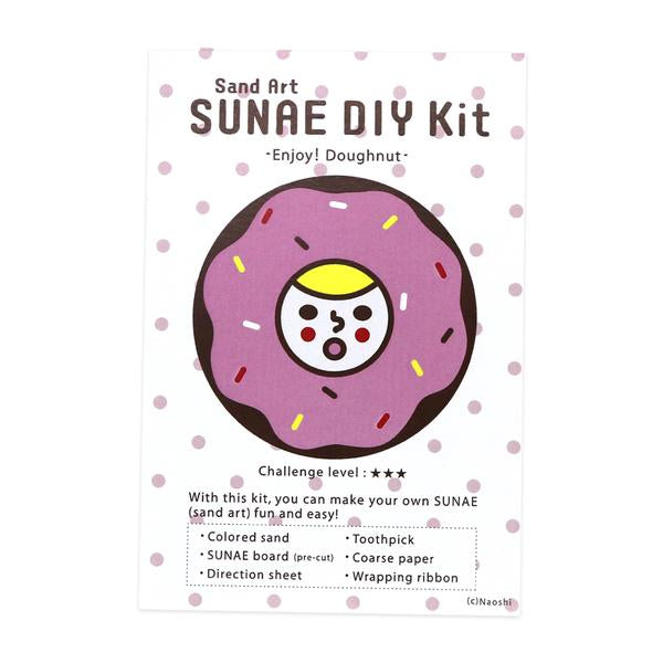 By Naoshi. With this kit, you can make your own fun and easy SUNAE (Sand Art)! Contents of Enjoy Donuts SUNAE DIY Kit: Colored Sand. SUNAE board (Pre-cut). Instructions. Coarse Paper. Toothpick. Wrapping Ribbon. Kit measures 4" width x 6" height.