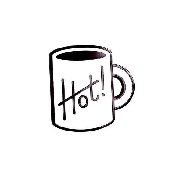 by Rather Keen. Have a hot cuppa! Hard enamel Hot Cuppa Pin. Black nickel metal with white enamel. Rubber clasp. Measures 7/8 inches tall. Also available in store at FOLD Gallery DTLA.