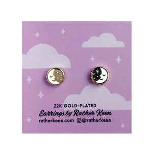 By Rather Keen. Sleepy Moon Stud Earrings. 22k gold-plated stud earrings. Nickel-Free! Please note that due to everyone’s monitor displaying differently, the colors you see may vary. Measures 10 mm wide.