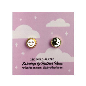 By Rather Keen. Sun and Moon Stud Earrings. ♫ But when the sun goes down. And the moon comes through. To the monotone of the evening's drone. I'm all alone with you ♫—Ella Fitzgerald. 22k gold plated stud earrings. Nickel-Free! Measures 11mm wide. Also available in store at FOLD Gallery DTLA.