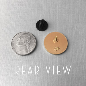 By Rather Keen. We're Doomed Star Wars C-3PO Quote Pin. For when your odds of successfully navigating an asteroid field are approximately 3,720 to 1. This pin features C-3PO's pessimistic dialogue in Star Wars. The reflective gold surface is just like C-3PO's head! Black enamel. Black rubber clasp. 3/4 x 3/4 inches. Also available in store at FOLD Gallery DTLA.