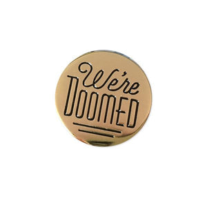 By Rather Keen. We're Doomed Star Wars C-3PO Quote Pin. For when your odds of successfully navigating an asteroid field are approximately 3,720 to 1. This pin features C-3PO's pessimistic dialogue in Star Wars. The reflective gold surface is just like C-3PO's head! Black enamel. Black rubber clasp. 3/4 x 3/4 inches. Also available in store at FOLD Gallery DTLA.