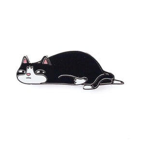By Shoal. Hard enamel Ennui Cat Pin with gunmetal finish. Double pin posts with rubber clutch backs. Measures 1.25 inches wide.