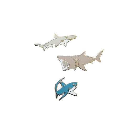 By Shoal. Tiny Sharks Pin Set. Designed in collaboration with Fin Pin. This pin set features a bonnethead, a basking, and a thresher shark. Hard enamel, silver metal finish, bonnethead and thresher shark have single pin posts, while basking shark has double pin posts. Measures between 0.6 - 1.1 inch in size. Also available in store at FOLD Gallery DTLA.