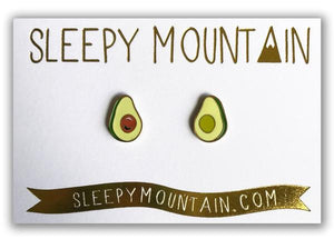 By Sleepy Mountain. Enamel Avocado Earrings are 22k gold plated stainless steel. Includes butterfly backings as well as nylon stops. Please note that due to everyone’s monitor displaying differently, the colors you see may vary. Measures 0.5 inches. FOLD Gallery Dtla.