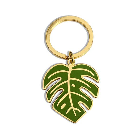 By Sleepy Mountain. Monstera Leaf Gold Keychain. The leaf measures 1.5 inches tall. Also available in store at FOLD Gallery DTLA.