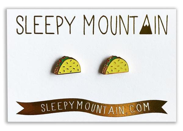 By Sleepy Mountain. Enamel color Taco Earrings are 22k gold plated stainless steel. Includes butterfly backings as well as nylon stops. Measures 0.5 inches. Also available in store at FOLD Gallery DTLA.