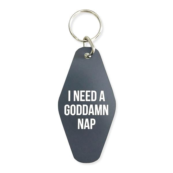 By Sweet Perversion. Goddamn Nap Motel Style Keychain: Laser engraved motel style keychain. Grey keychain with white text. 1 inch split key ring included. Measures 3.5 inches long.