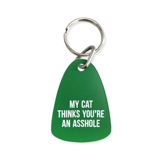 By Sweet Perversion. My Cat Thinks You're An Asshole Keychain: Laser engraved motel style keychain. Green keychain with white text. 1 inch split key ring included. Measures 2.25 inch long. Also available in store at FOLD Gallery DTLA.