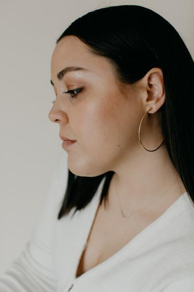 By TUMBLE. These Big Hoop Gold Filled Earrings are the perfect way to make a statement without weighing your ears down. All posts are sterling silver. Measures 2.5 inches. FOLD Gallery Dtla.