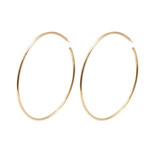 By TUMBLE. These Big Hoop Gold Filled Earrings are the perfect way to make a statement without weighing your ears down. All posts are sterling silver. Measures 2.5 inches. FOLD Gallery Dtla.